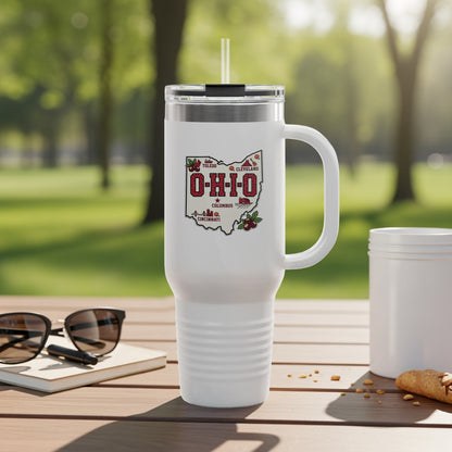 White tumbler with Ohio cities map and skyline graphic, resting on table.