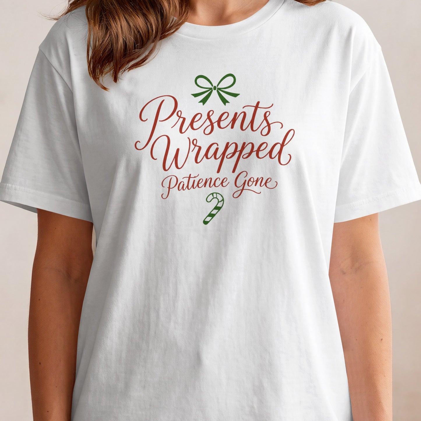 White t-shirt with red text: Presents Wrapped Patience Gone and green bow/candy cane.
