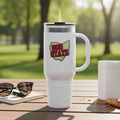 White insulated tumbler with Ohio State logo on a wooden table.