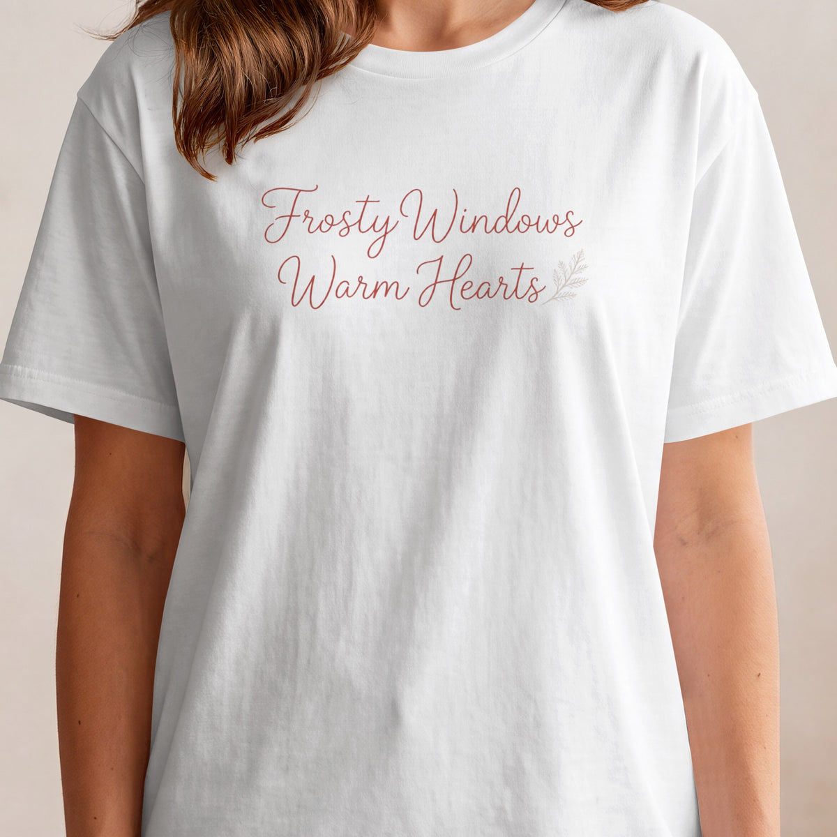 White t-shirt with "Frosty Windows Warm Hearts" text and a leaf accent.
