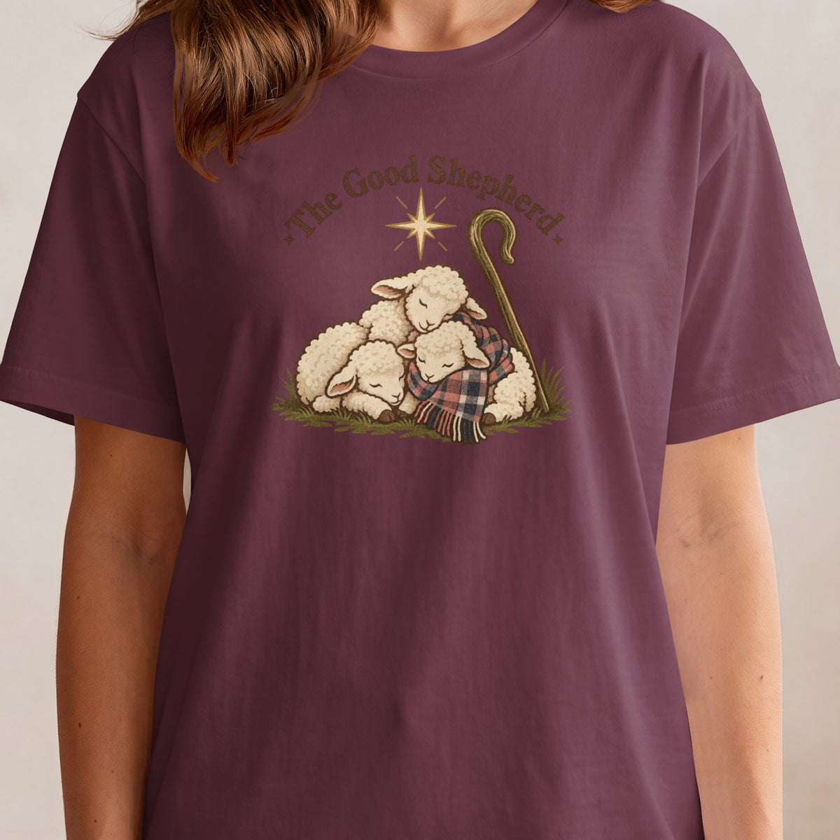 Three sheep rest under a star, with a shepherd's crook and text "The Good Shepherd."