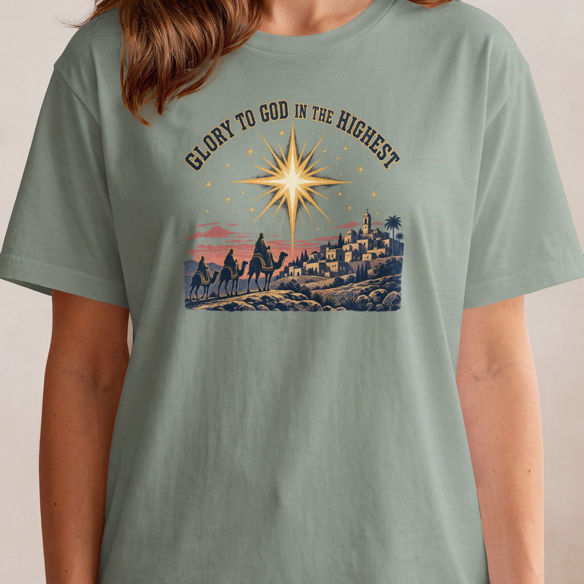 Three wise men on camels approach a starry Bethlehem under the words "Glory to God in the Highest."