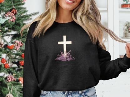 Black sweatshirt with white cross and purple floral design.