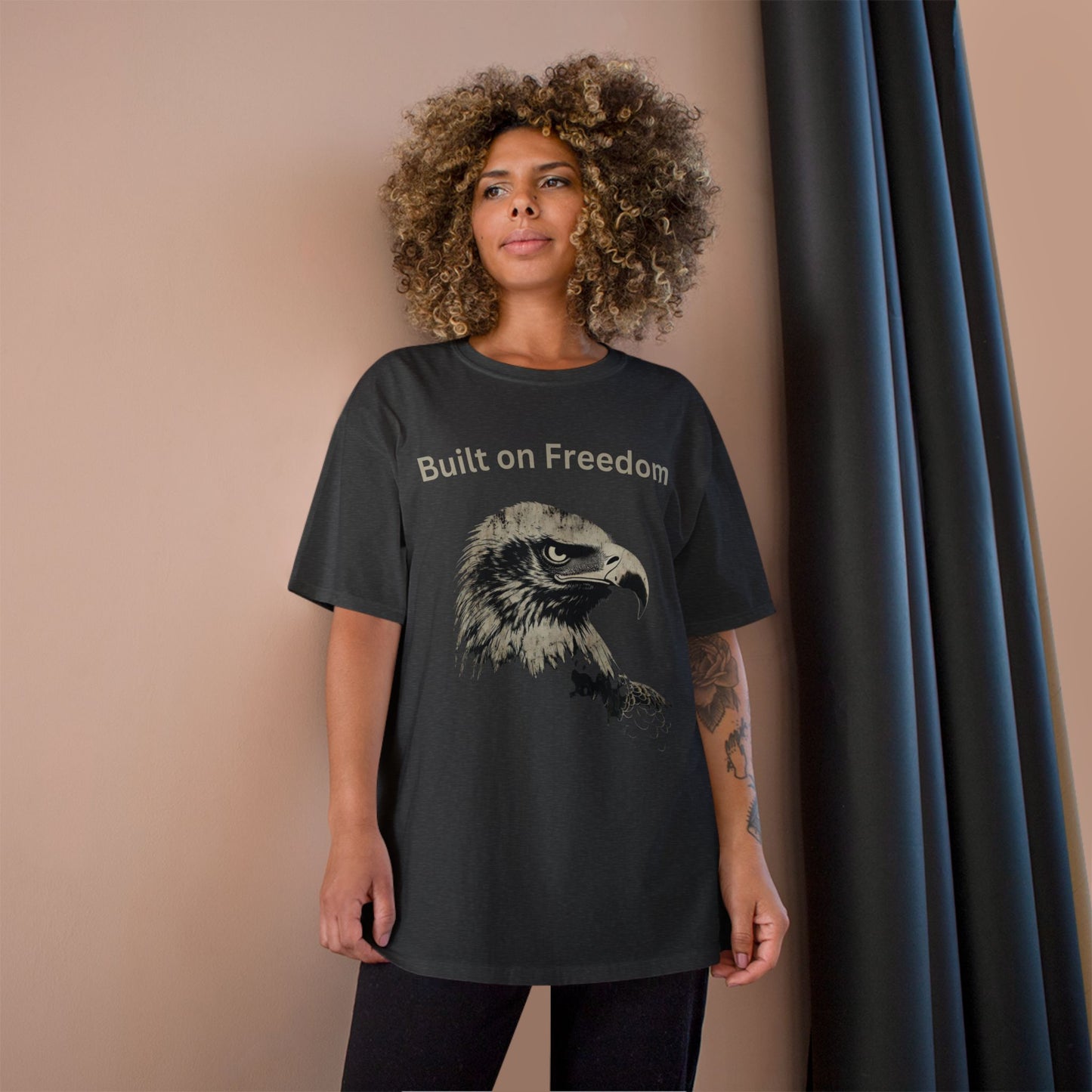 Built on Freedom text above an eagle head on a Champion Tee