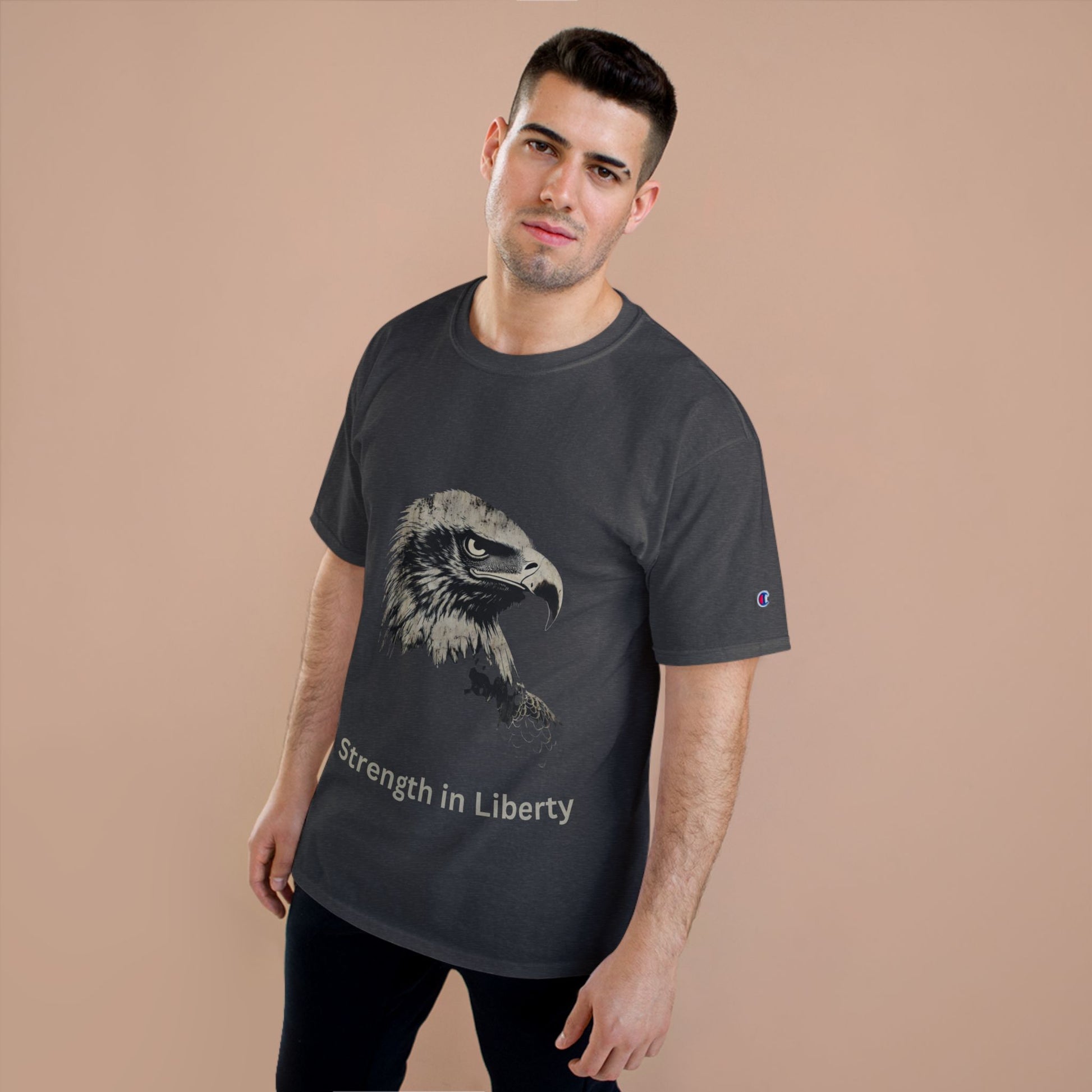 Strength in Liberty text below an eagle head on a Champion Tee