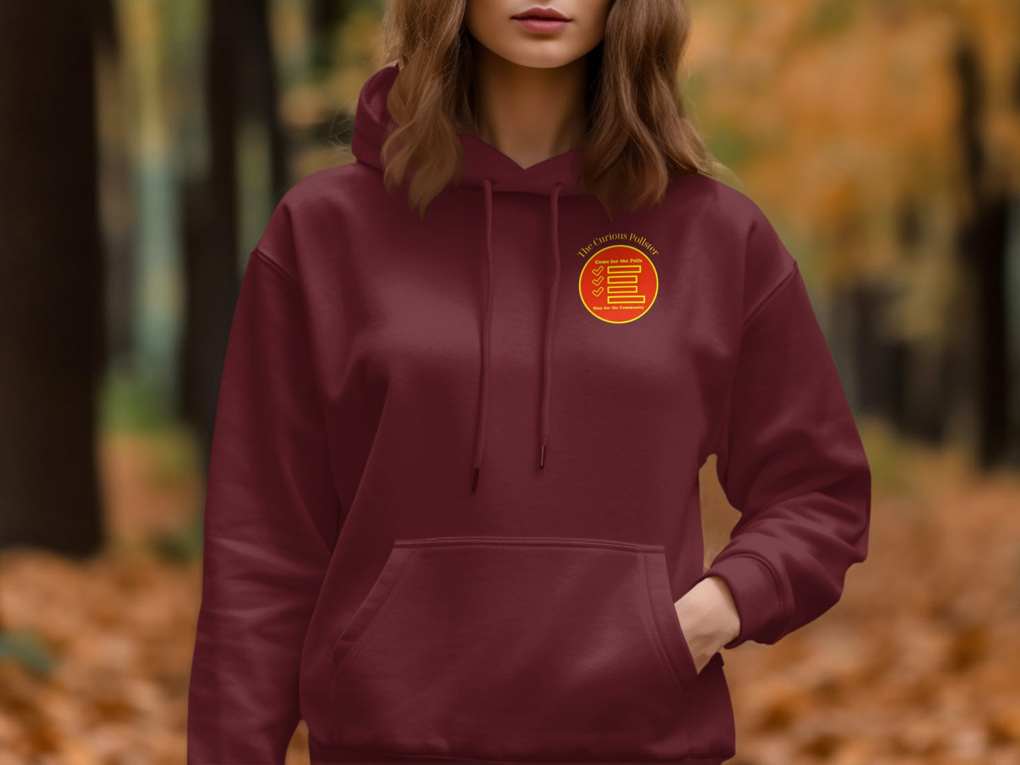 Maroon hoodie with yellow and red circular logo on chest.