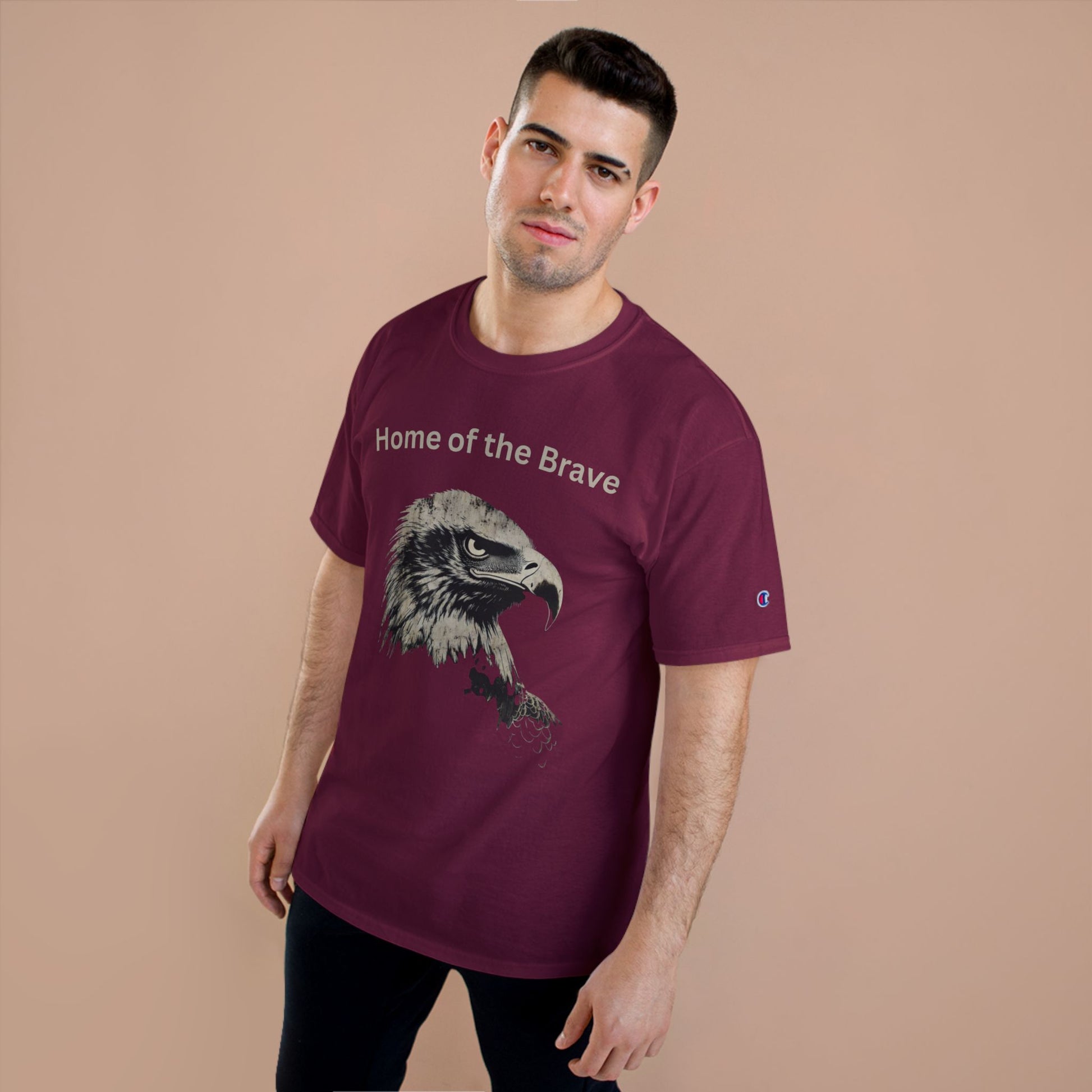 Home of the Brave text above an eagle head on a Champion Tee