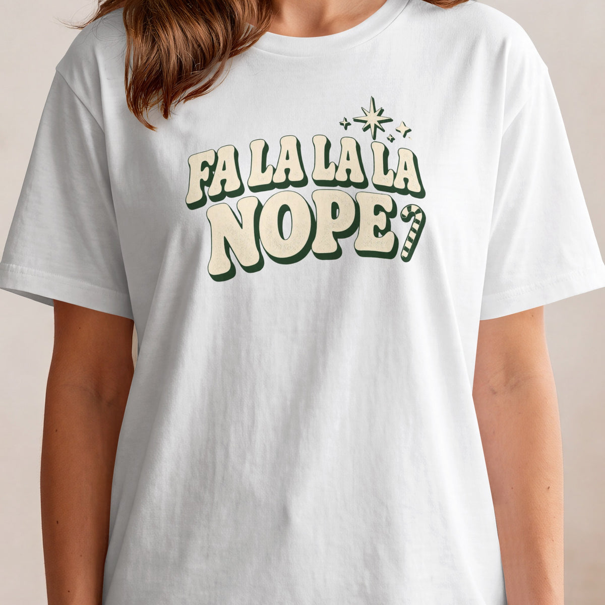 White t-shirt with "Fa la la la NOPE?" and candy cane graphic.