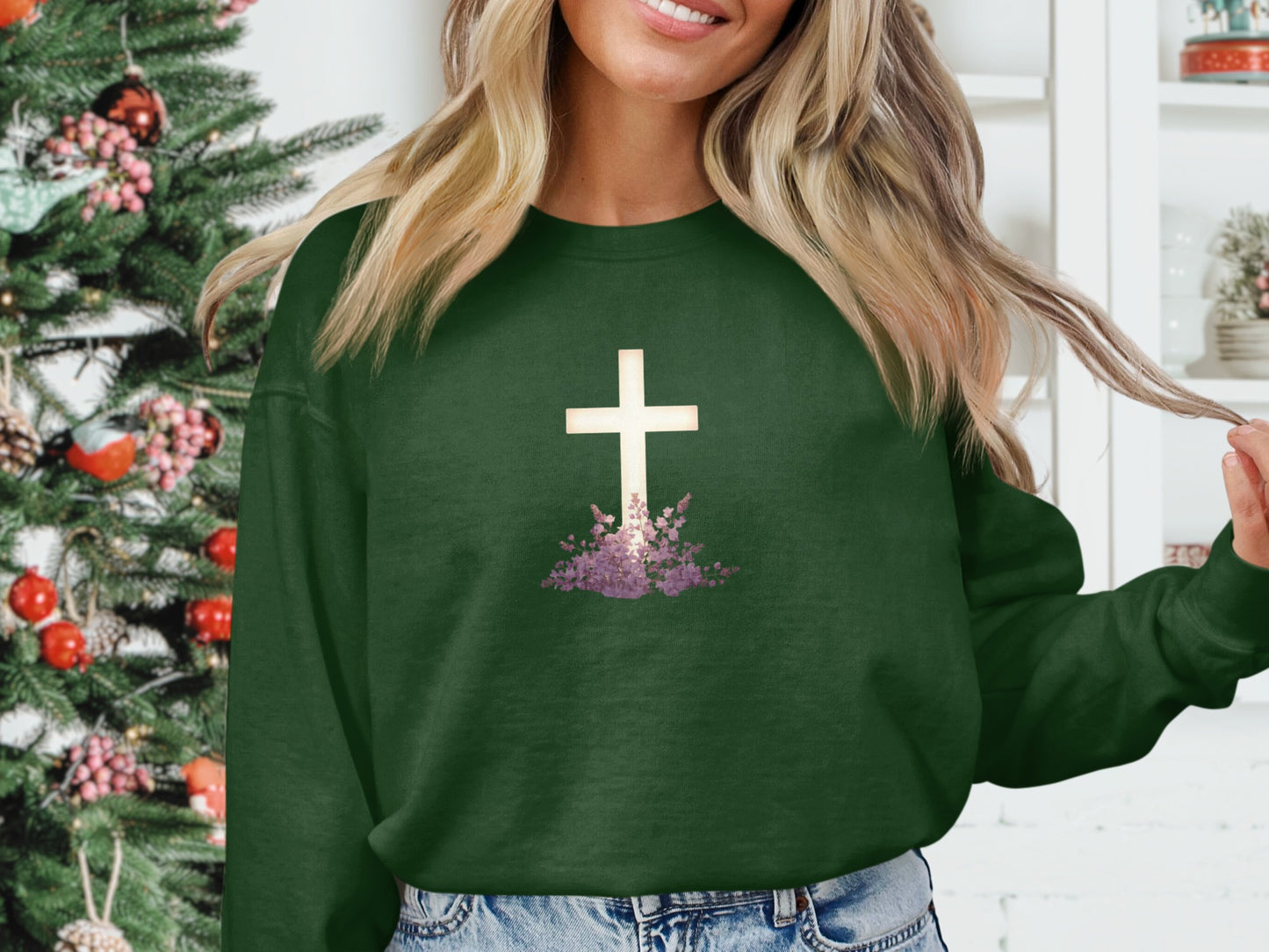 Green sweatshirt with white cross and purple flowers design.