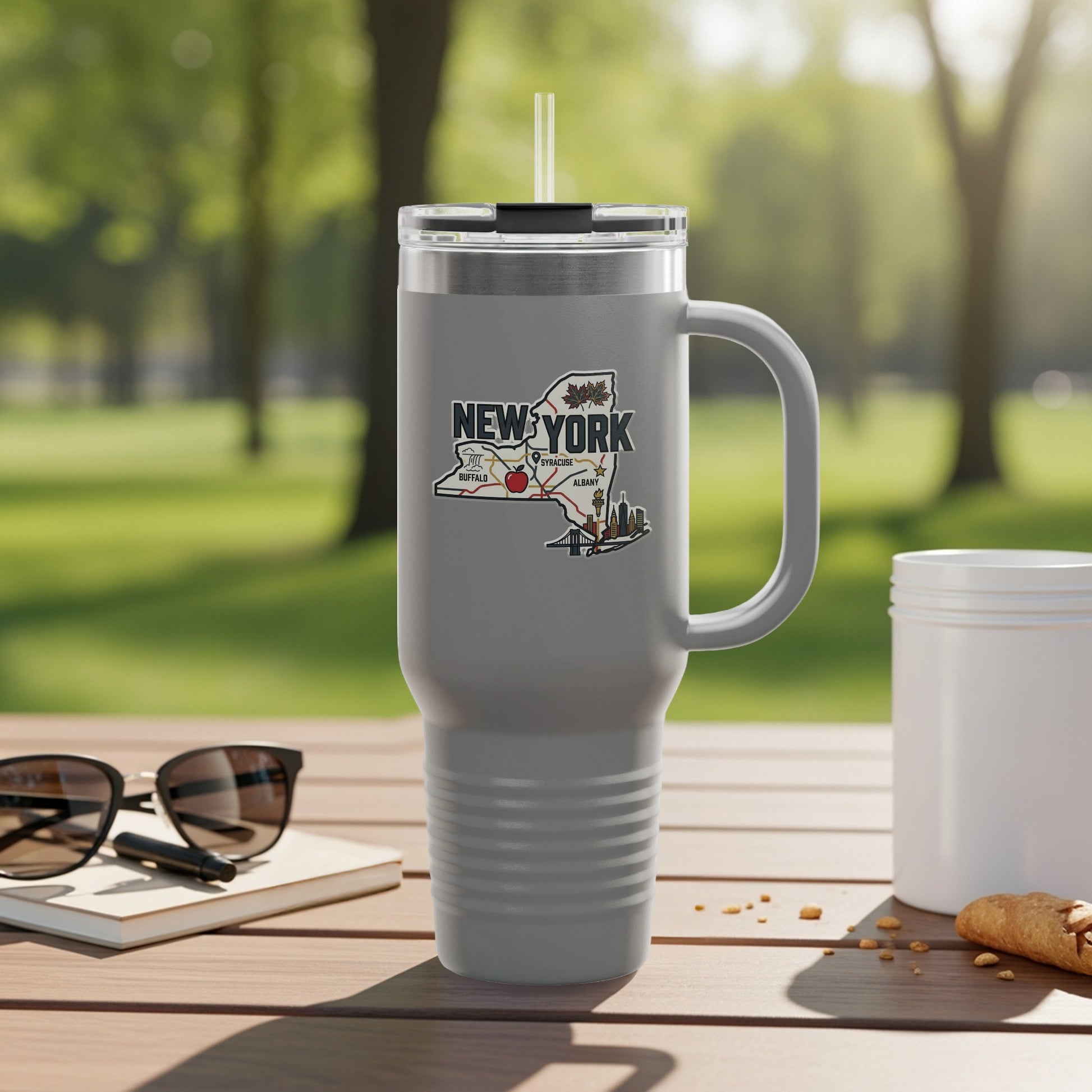 Gray travel mug with a New York State map sticker featuring Buffalo, Syracuse, and Albany.