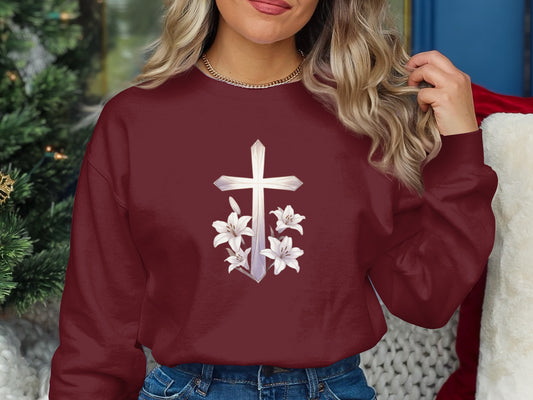 Maroon sweatshirt with a white cross and lilies graphic.