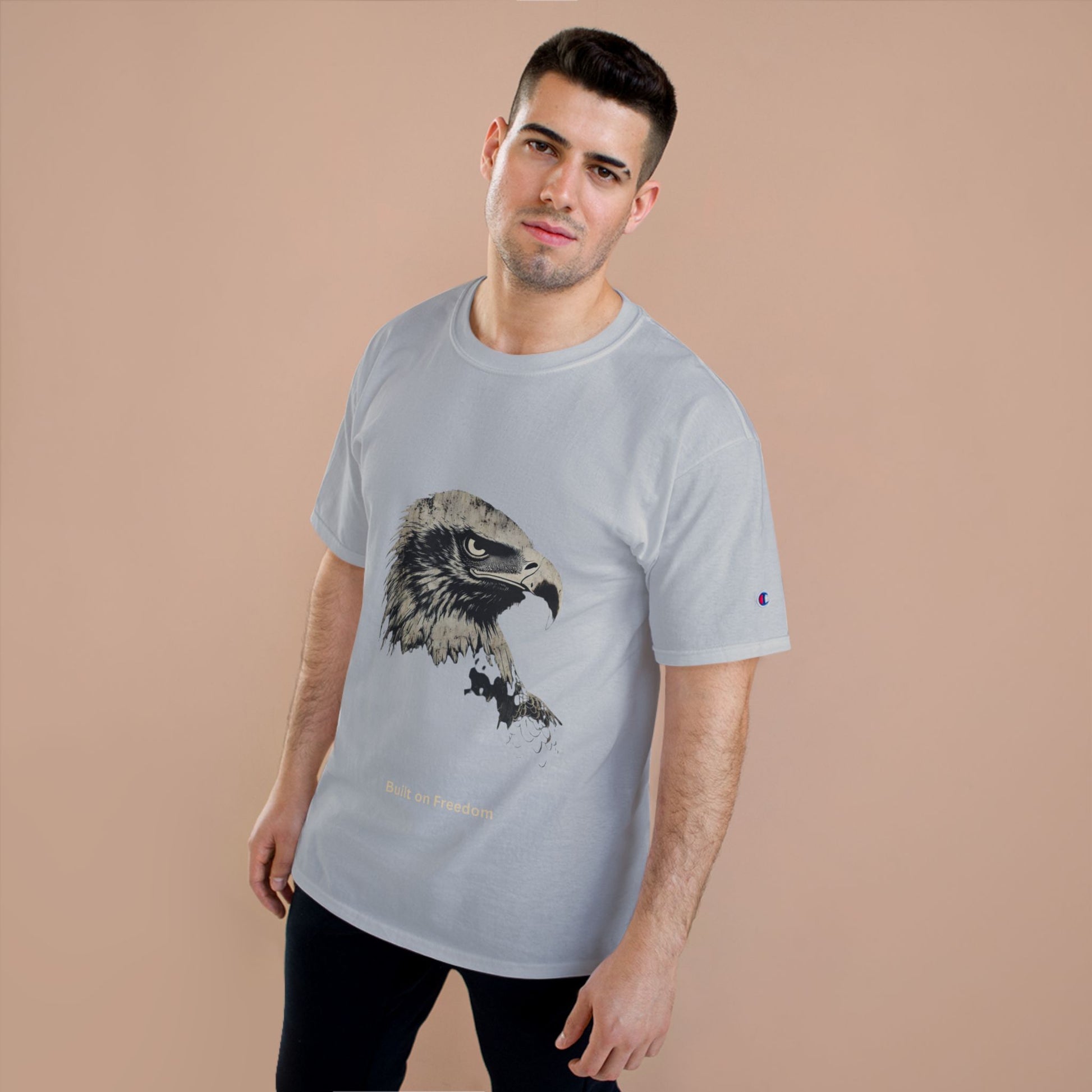 Built on Freedom small font text below an eagle head on a Champion Tee