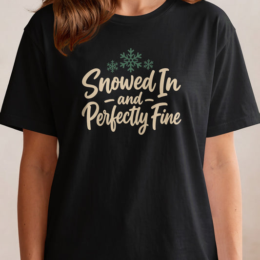 Black t-shirt with "Snowed In and Perfectly Fine" text and snowflakes.