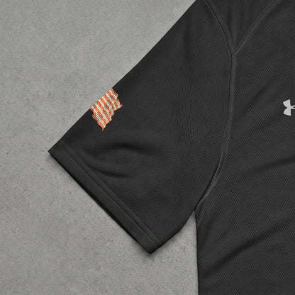 Black Under Armour t-shirt sleeve with orange checkered patch.