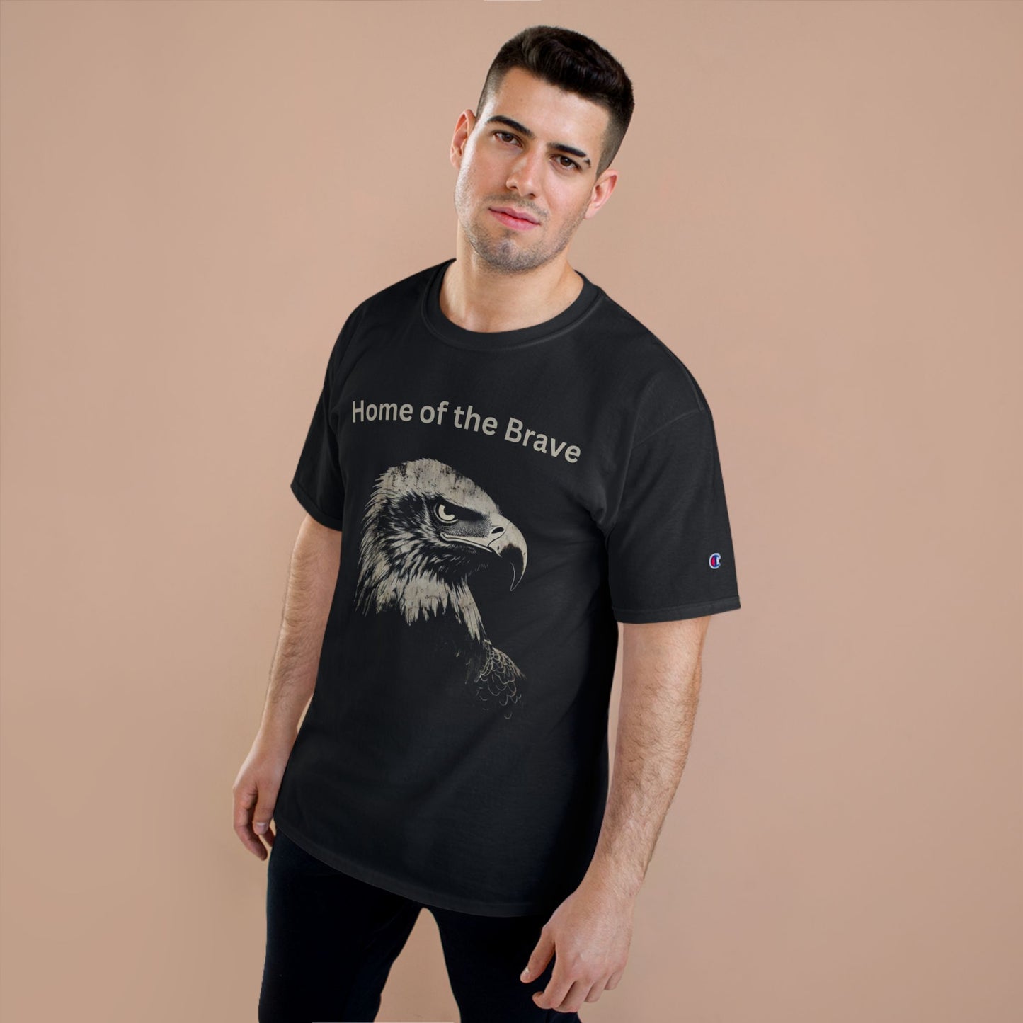 Home of the Brave text above an eagle head on a Champion Tee