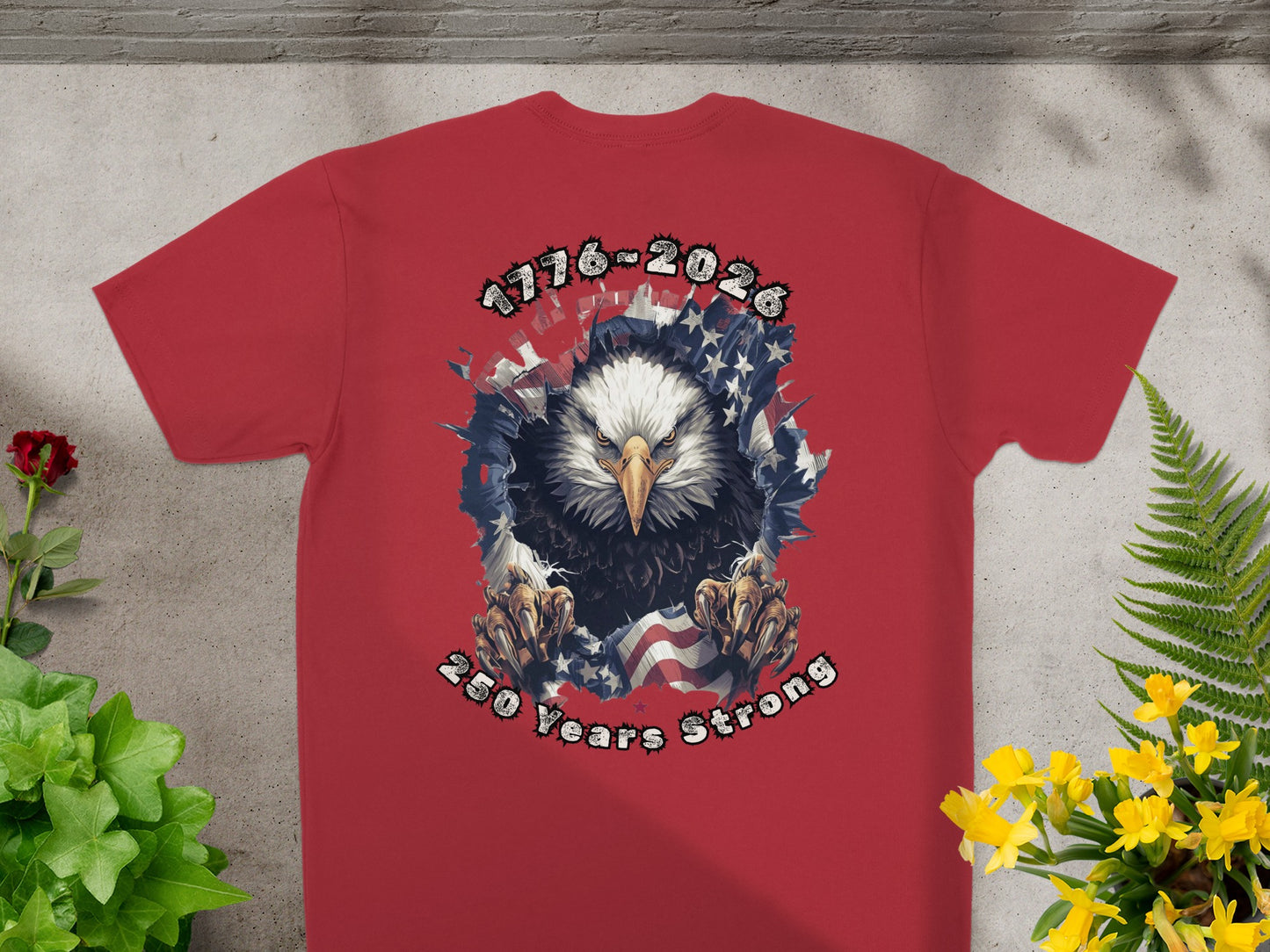 Red t-shirt with eagle graphic and "1776-2026 250 Years Strong" text.