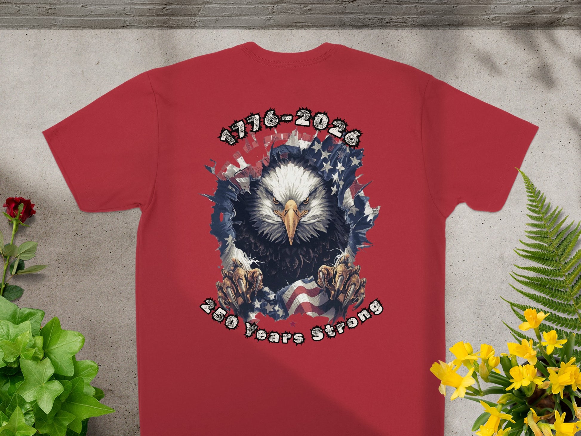 Red t-shirt with eagle graphic and "1776-2026 250 Years Strong" text.