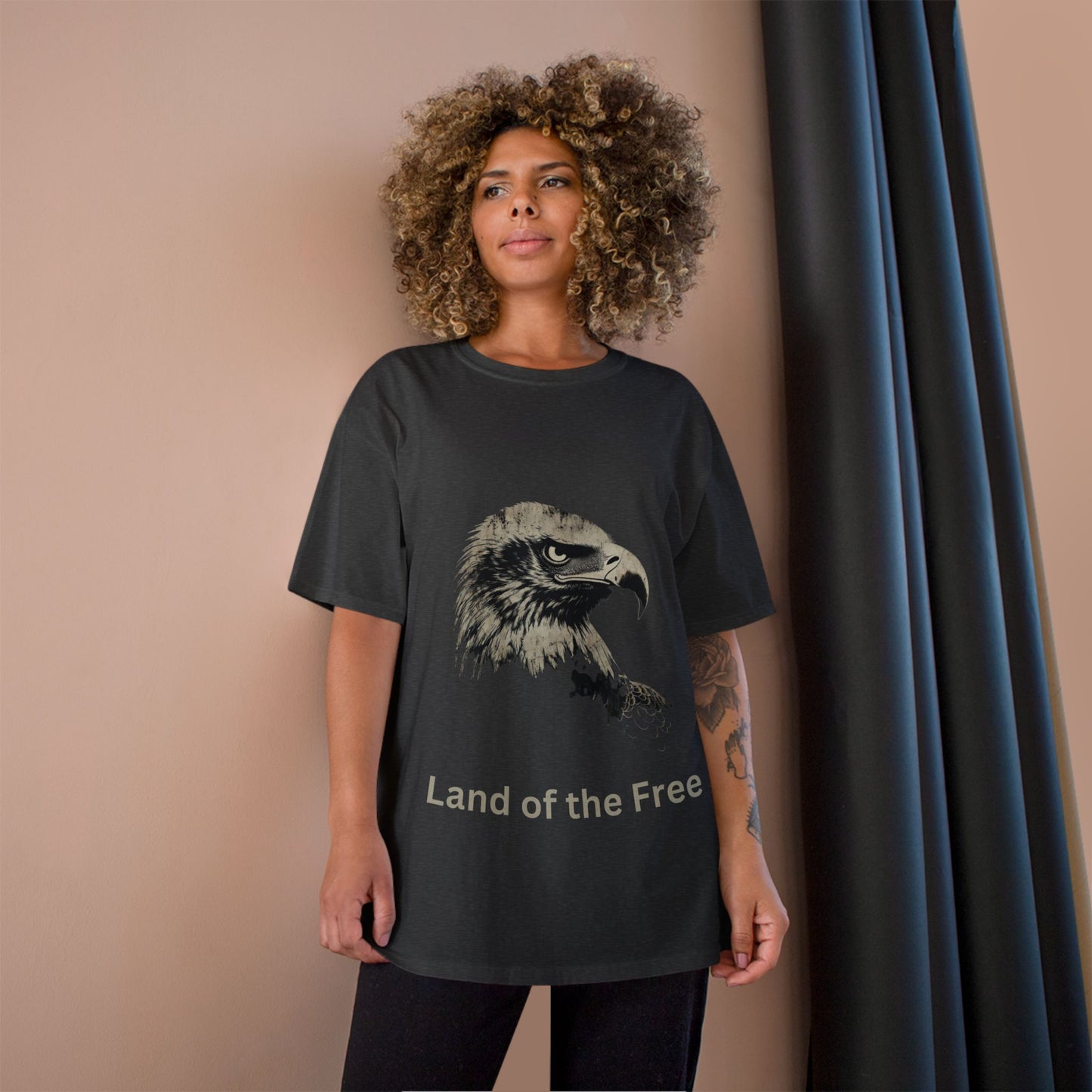 Land of the Free text below an eagle head on a Champion Tee