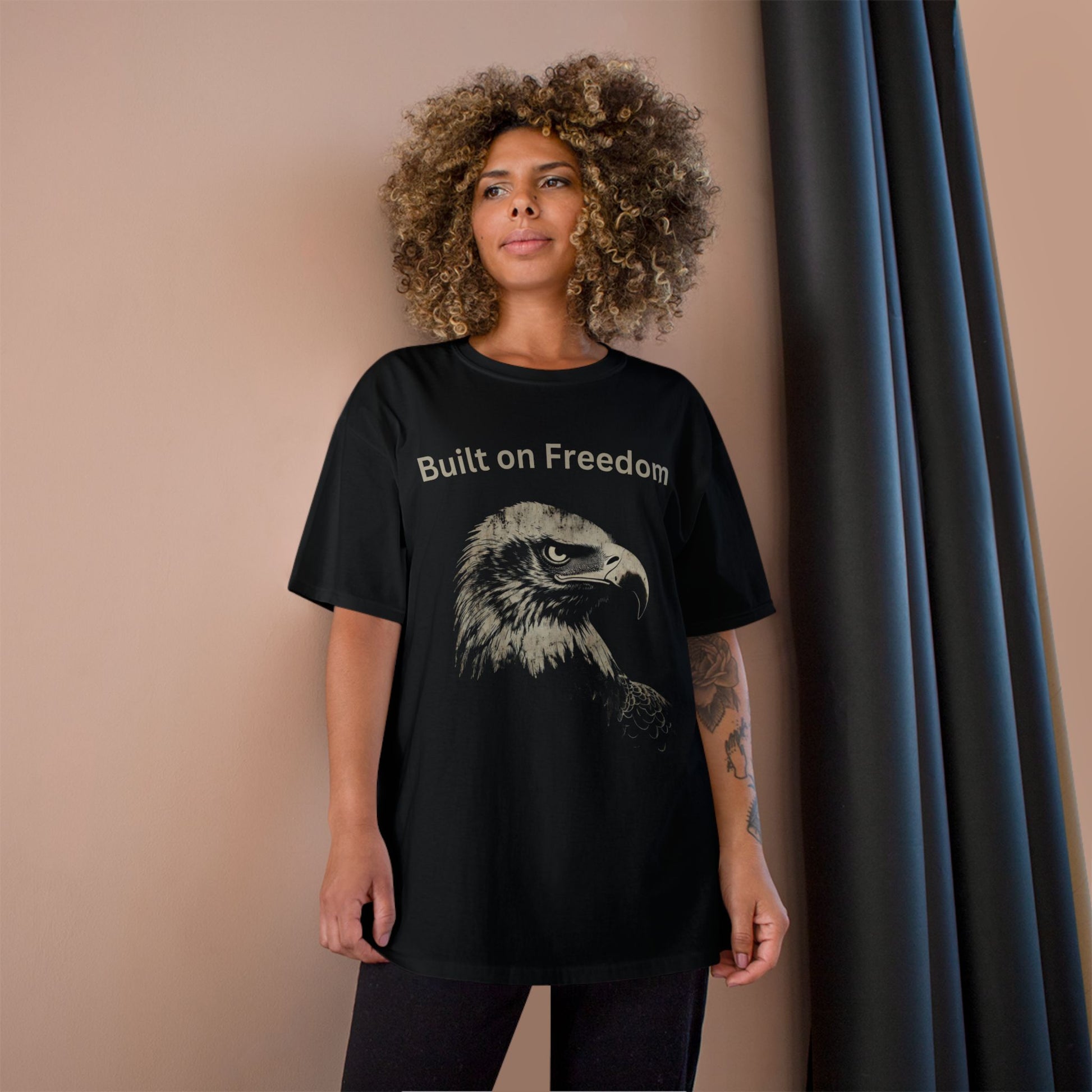Built on Freedom text above an eagle head on a Champion Tee
