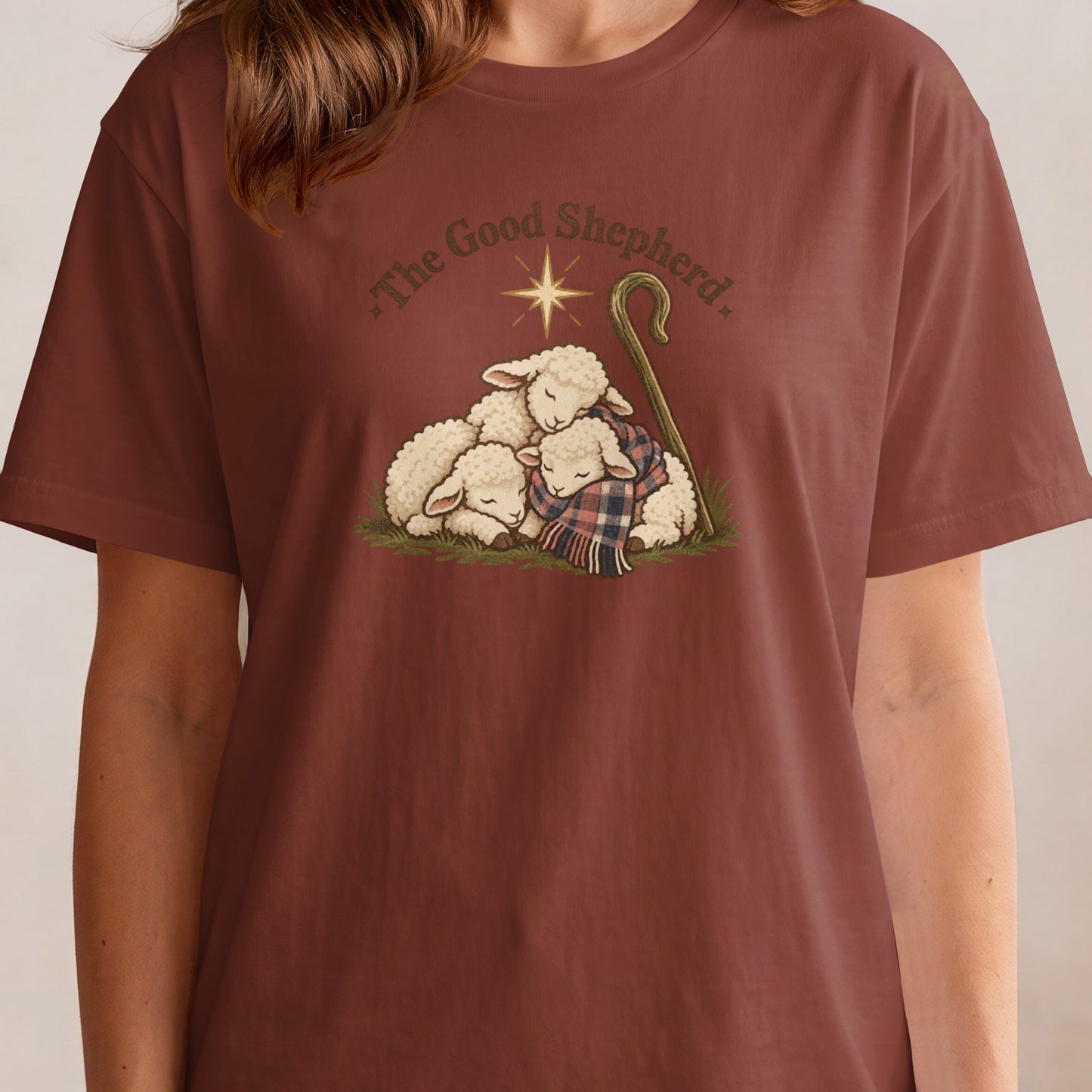 Three sleeping sheep huddle together under a shepherd's crook with the text "The Good Shepherd".