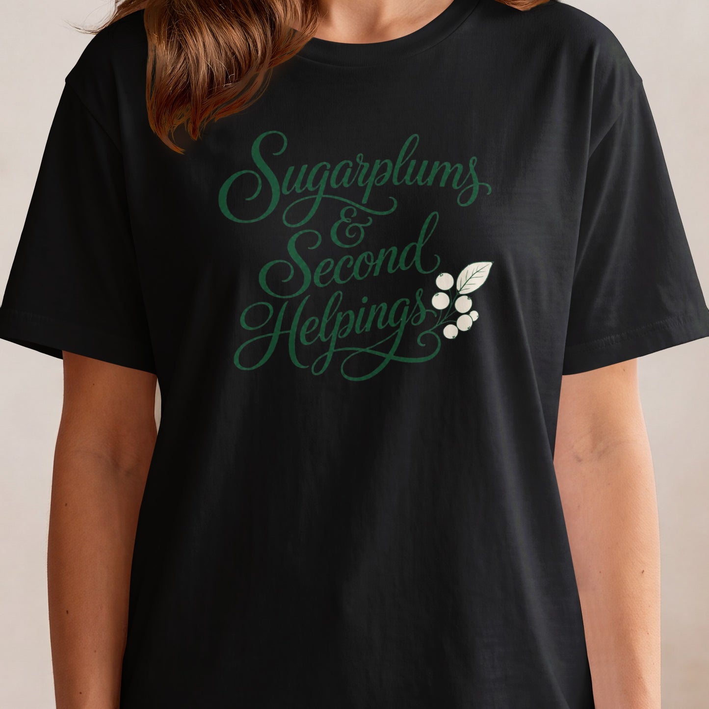 Black t-shirt with green cursive text "Sugarplums & Second Helpings" and white berries.