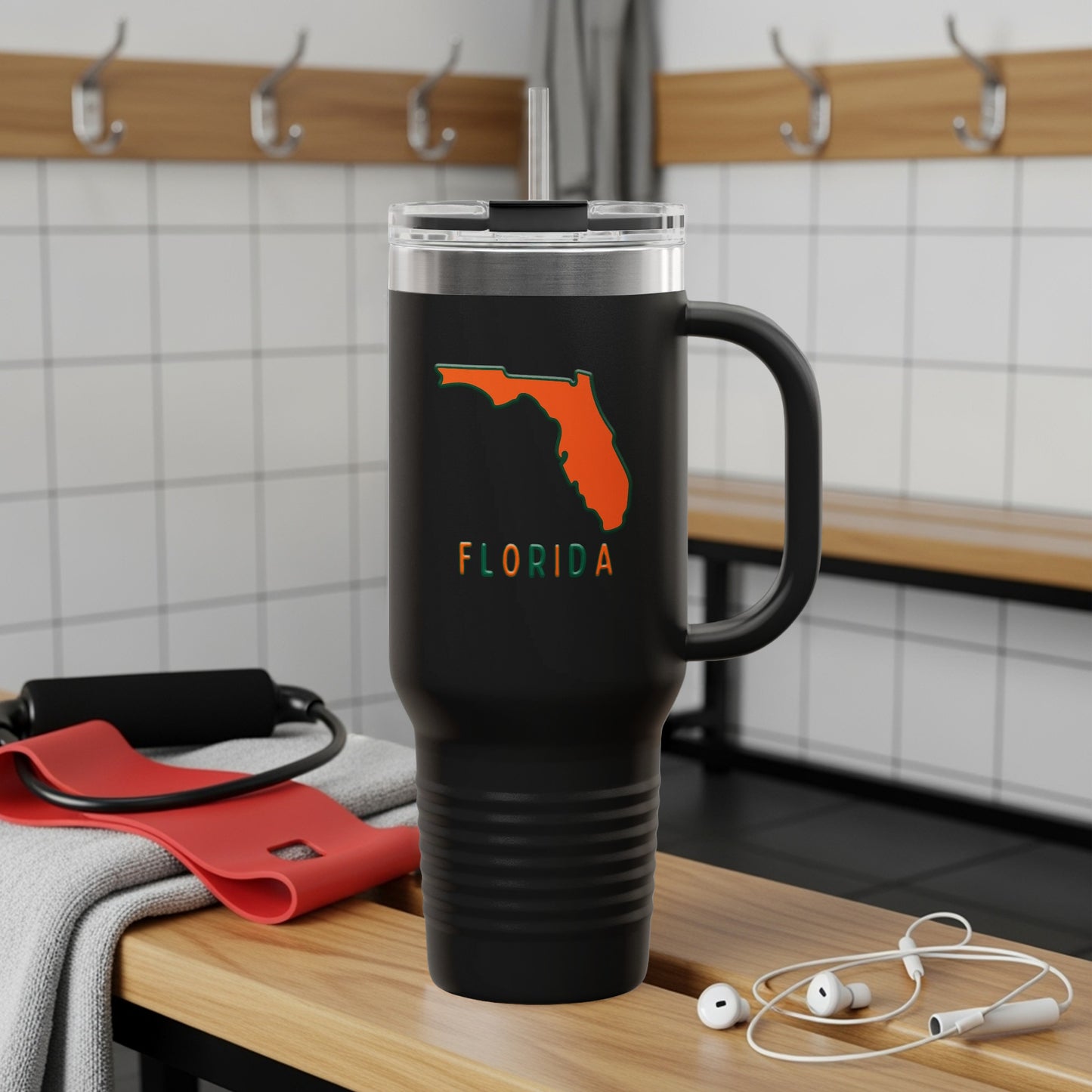 Travel tumbler with Florida Sunshine State logo, outdoors.