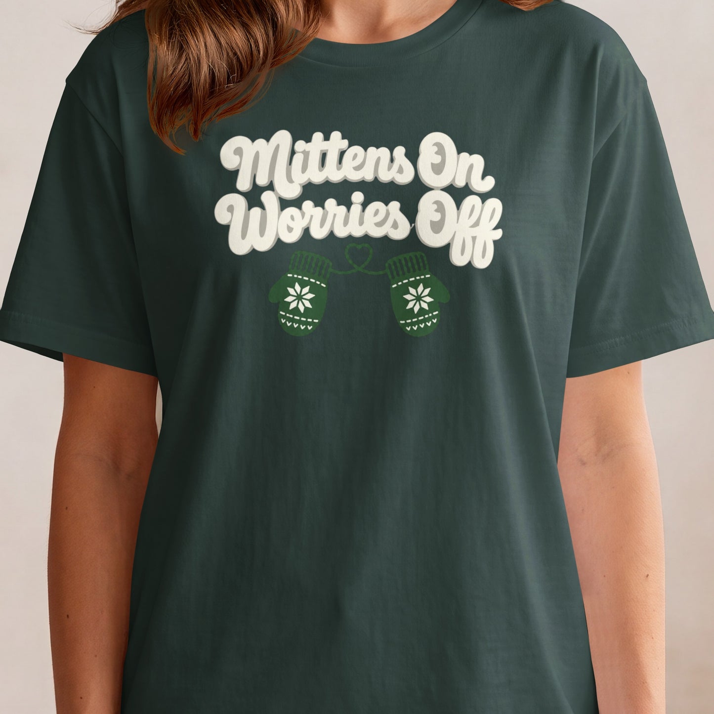 Green t-shirt with white text "Mittens On Worries Off" and two green mittens.