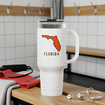 White tumbler with orange Florida outline and "FLORIDA" text.