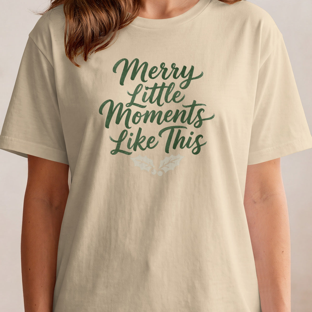 Cream t-shirt with green text that reads "Merry Little Moments Like This".