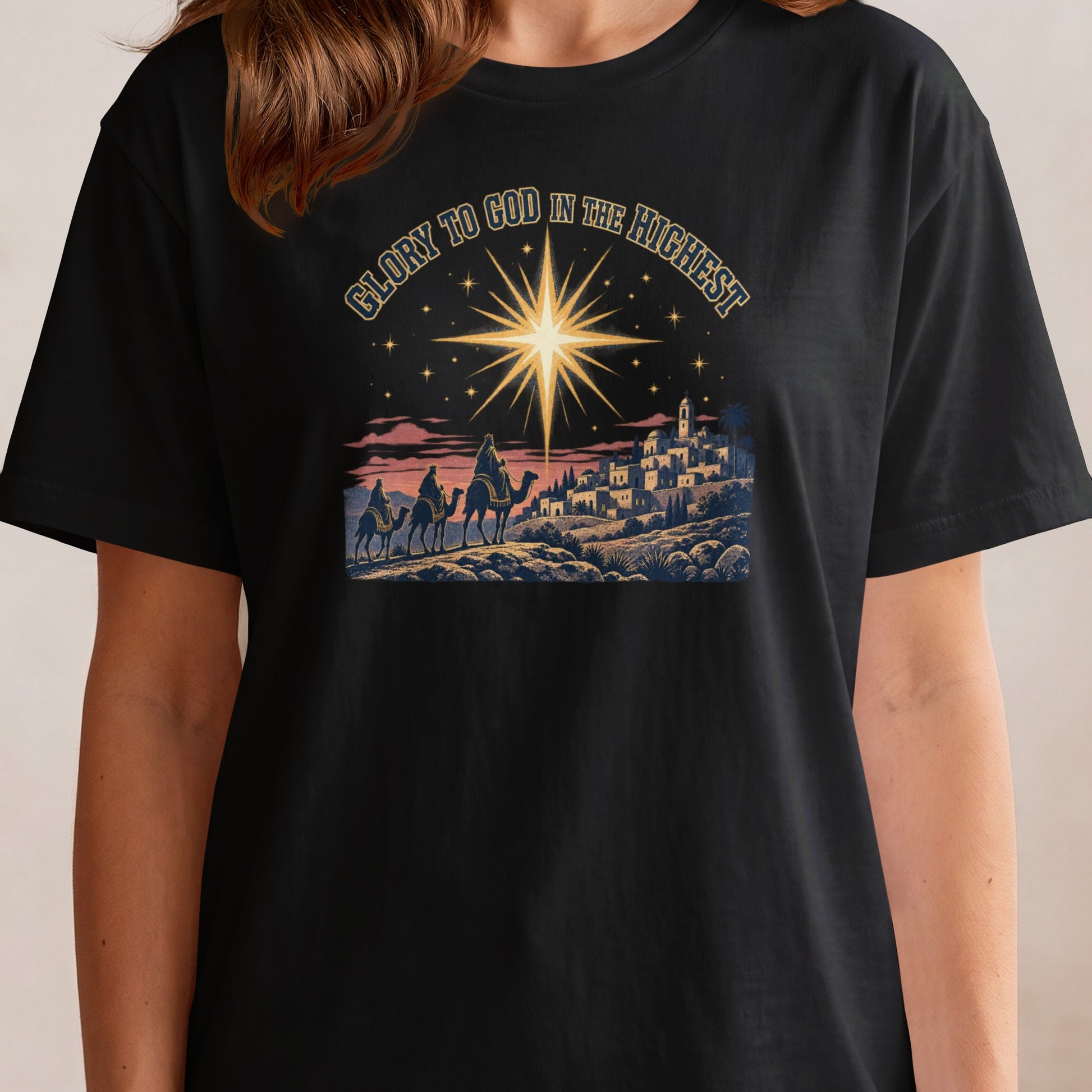 Nativity scene with three wise men on camels beneath a star, text "Glory to God in the Highest".