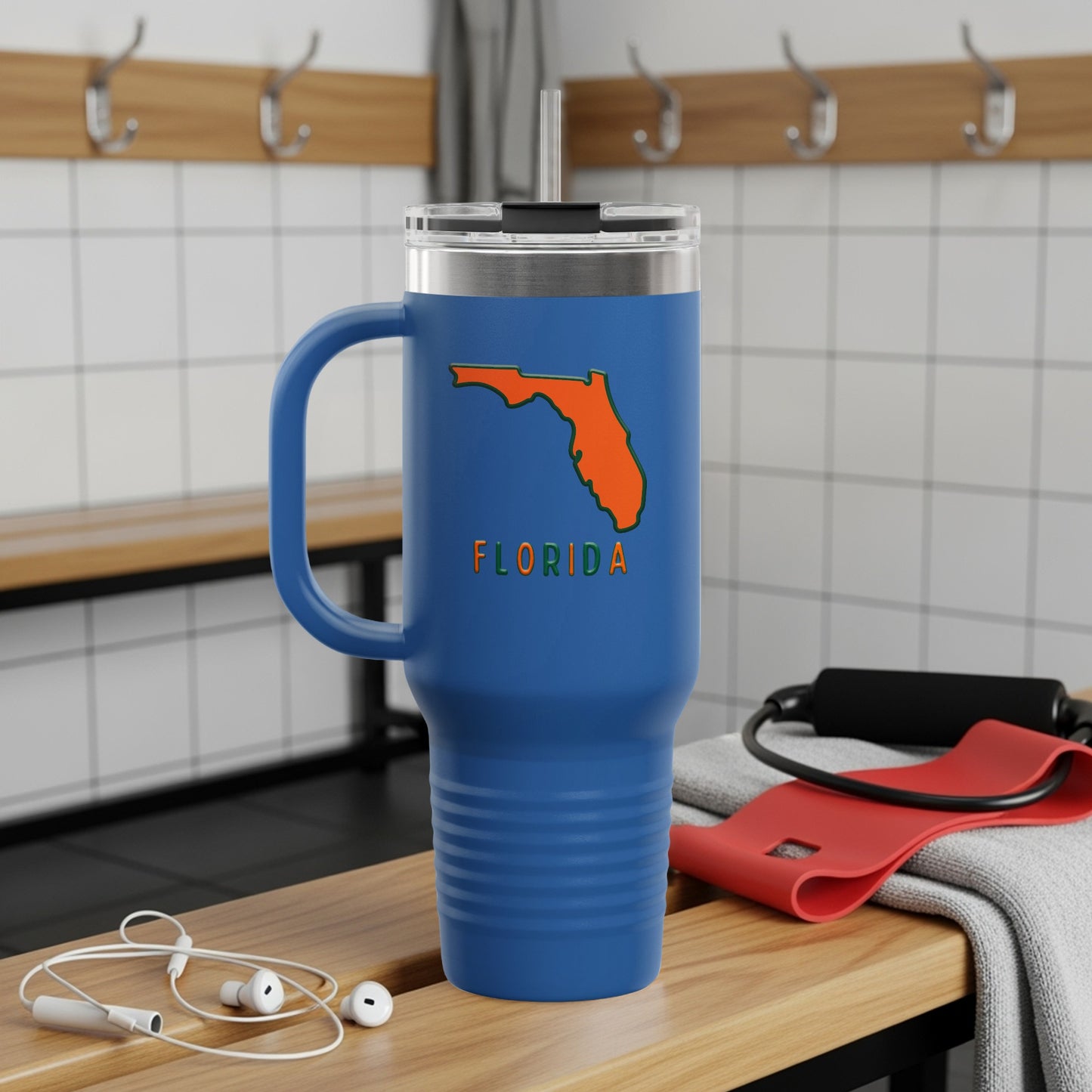 Travel tumbler with Florida Sunshine State logo, outdoors.
