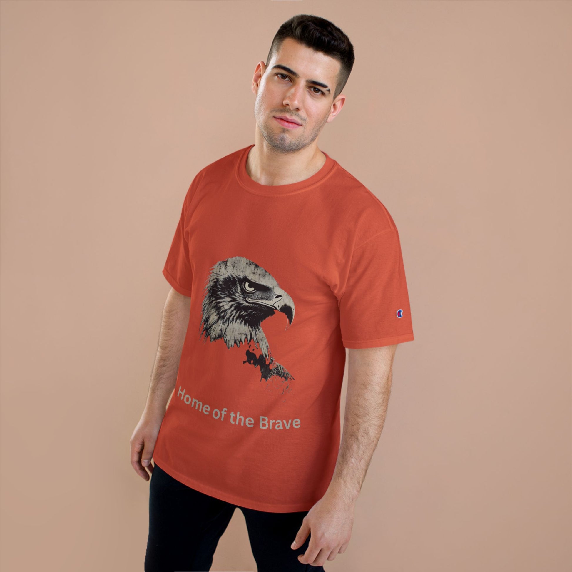 Home of the Brave text below an eagle head on a Champion Tee
