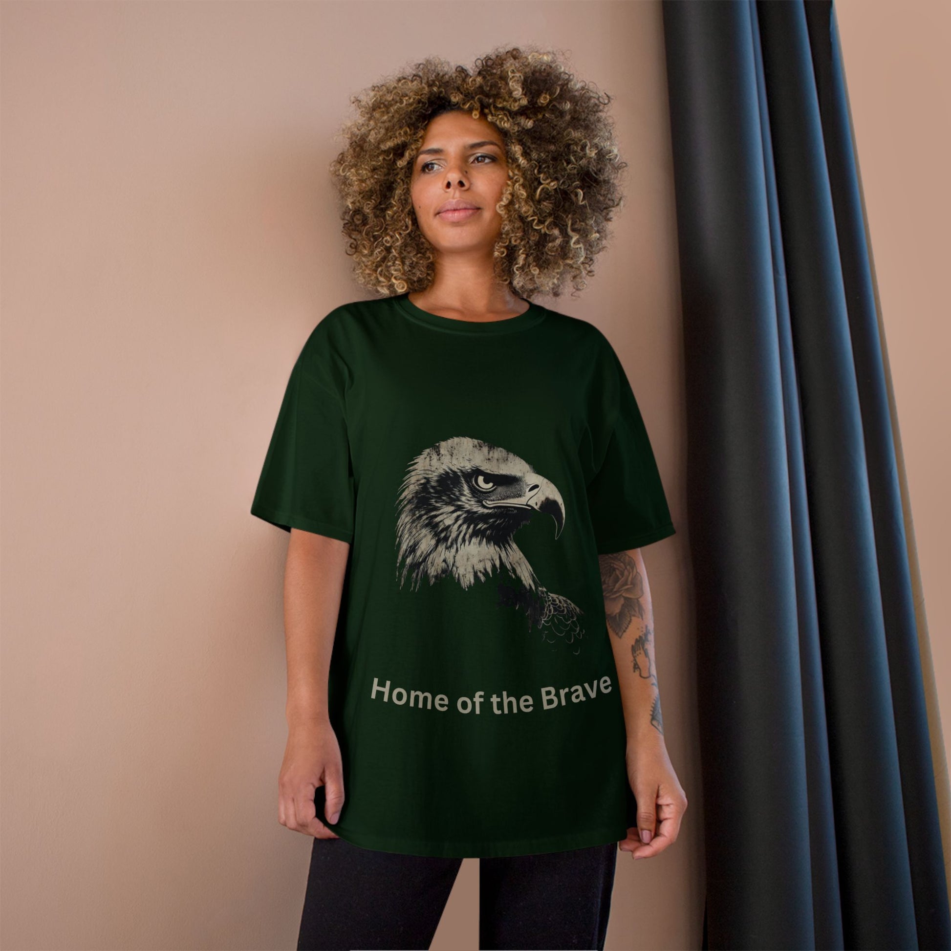 Home of the Brave text below an eagle head on a Champion Tee