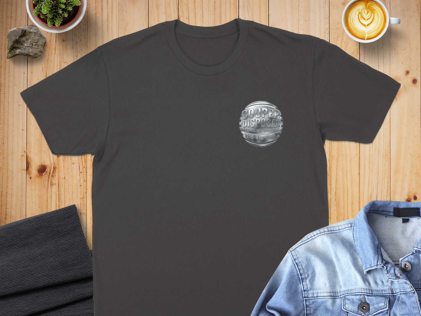 Charcoal t-shirt with circular silver Cooper Disposal logo on chest.
