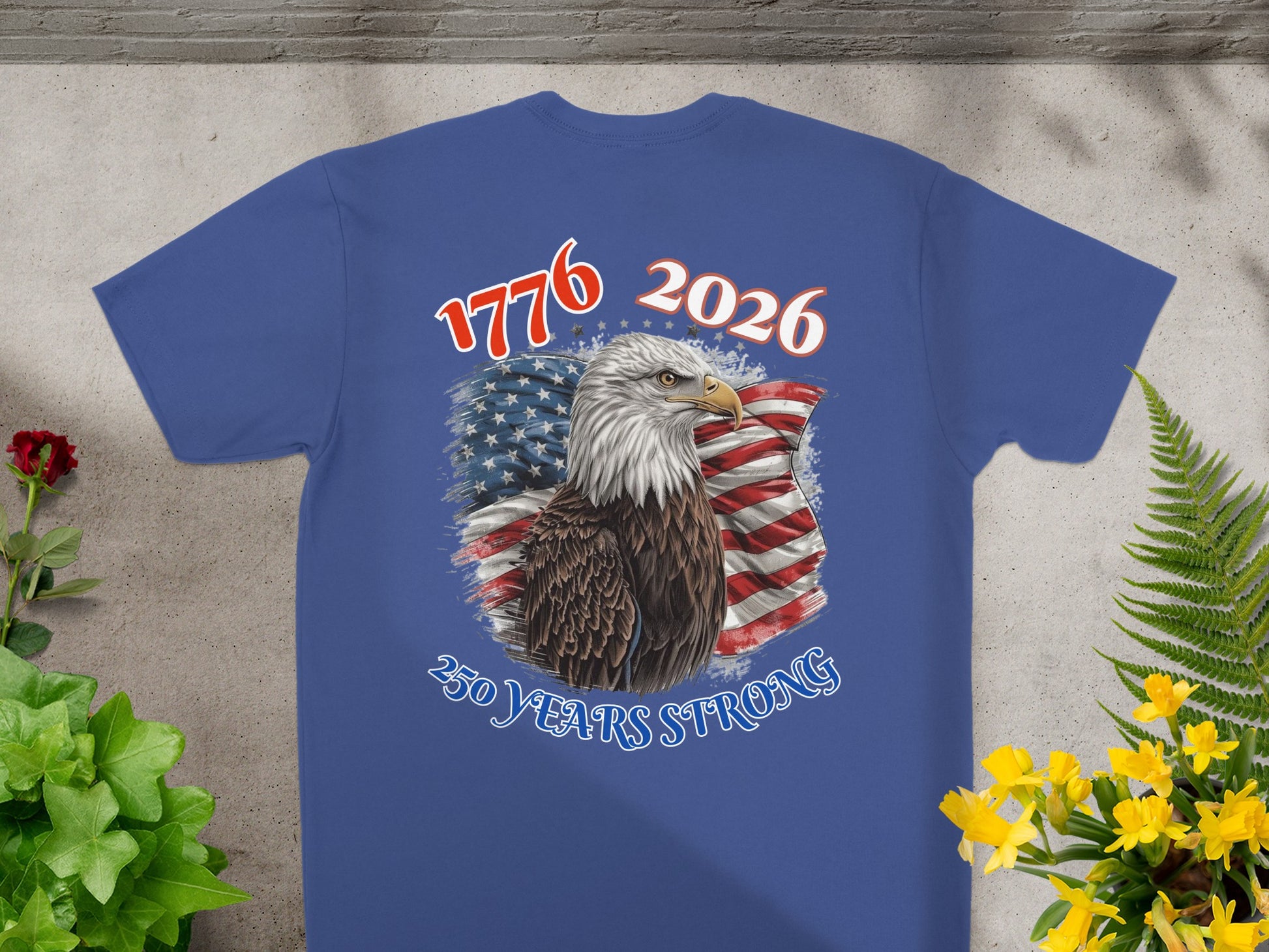 2026 250 years strong eagle and flag graphic on blue t-shirt.