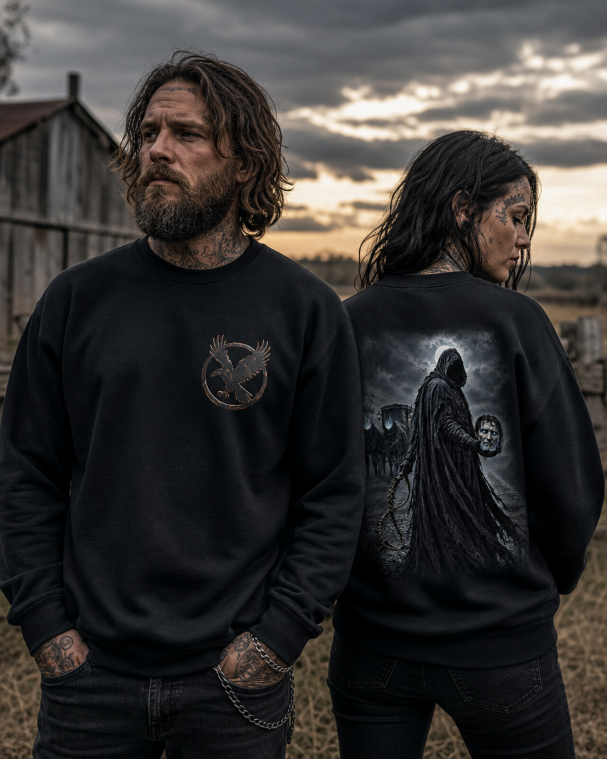 Two models wearing black Dark Folklore Series Dullahan crewneck sweatshirts, front view, with the raven in flight emblem on the chest.