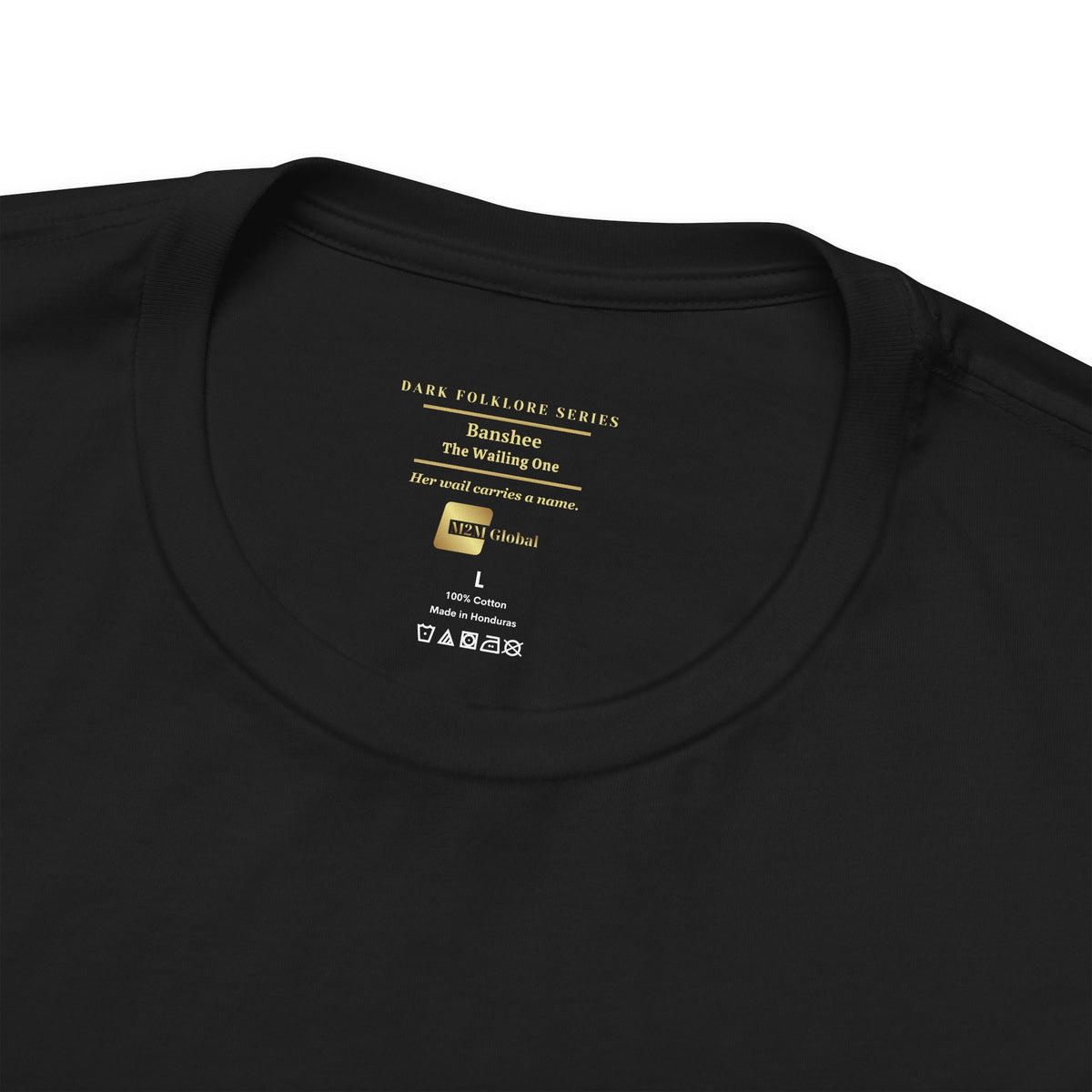 Close-up of a black crewneck t-shirt showing the inner neck label with gold text reading Banshee, The Wailing One, Dark Folklore Series on a black collar.