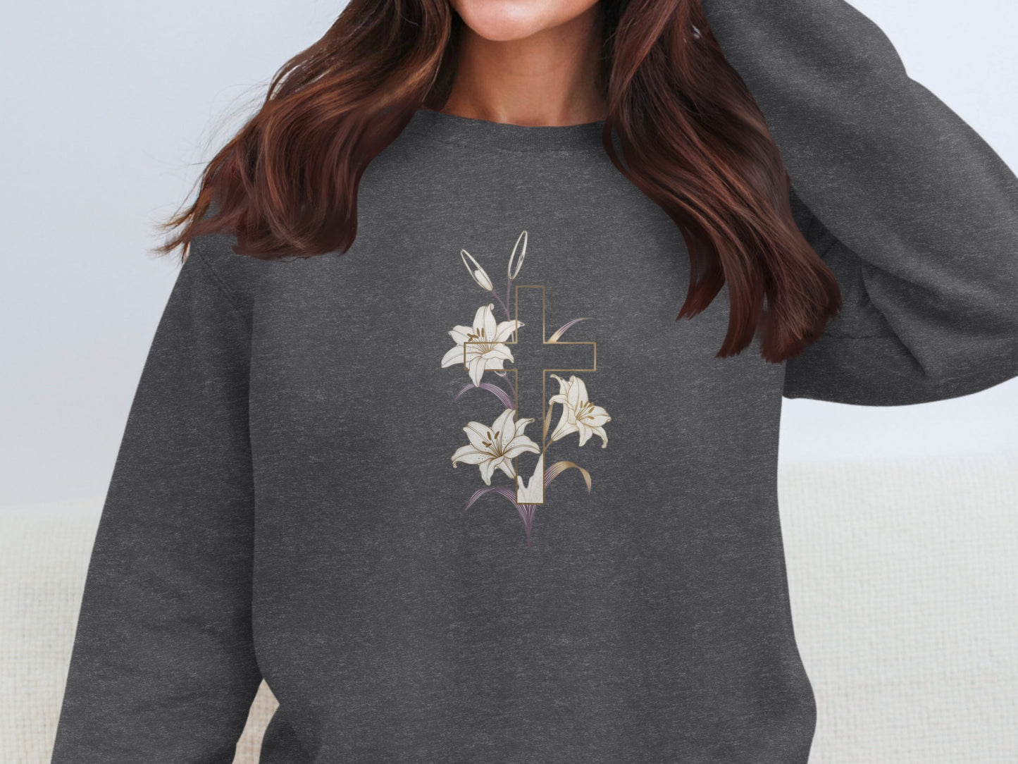 Dark gray sweatshirt with a gold cross and white lilies design.