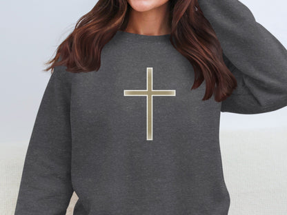 Dark grey crewneck sweatshirt with a metallic gold cross design.