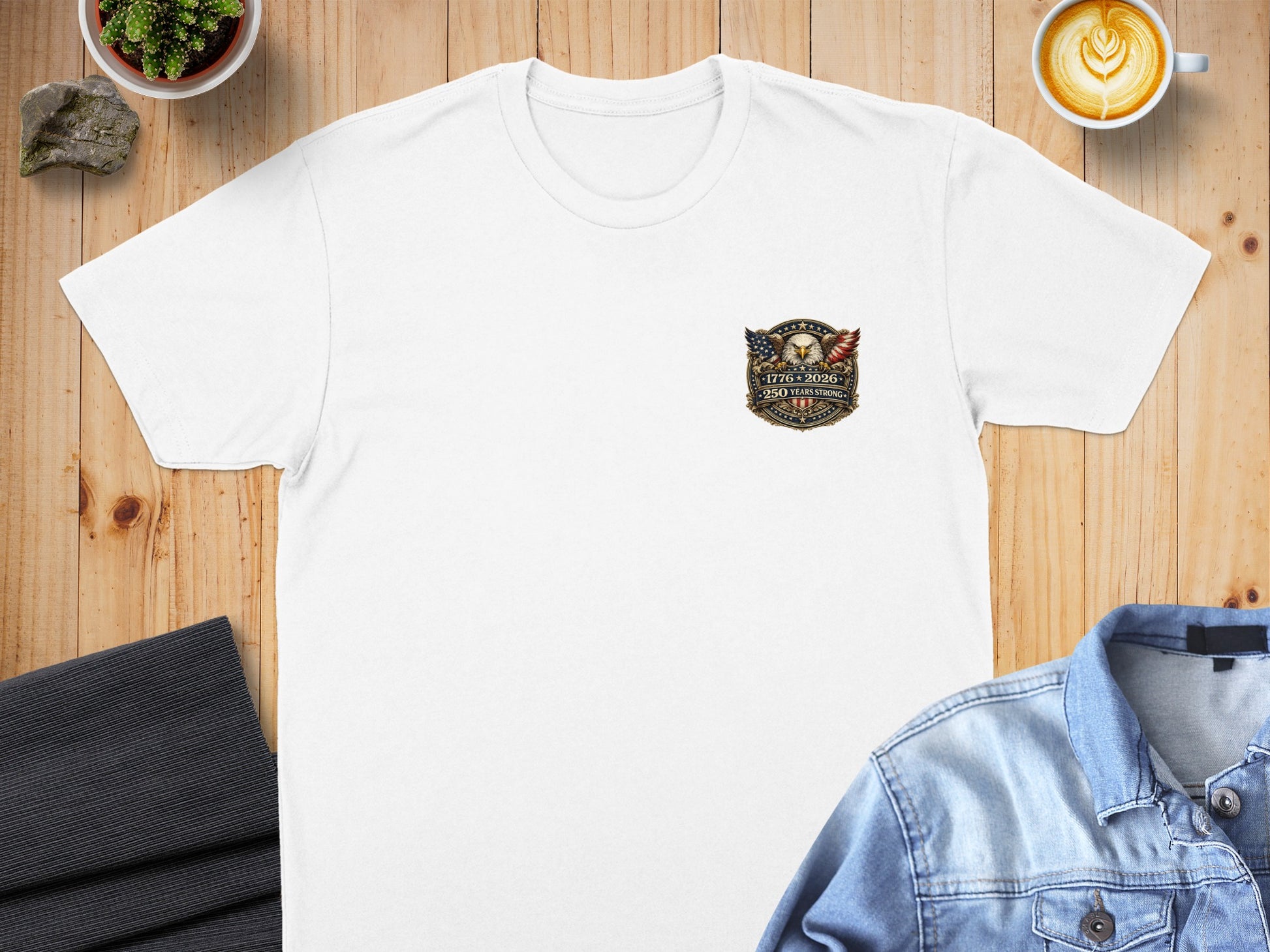 White t-shirt with an eagle crest logo and "2026 250 Years" text.