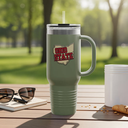 Olive green tumbler with Ohio State logo sits on a table.