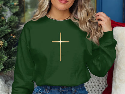 Green sweatshirt with a gold cross graphic.