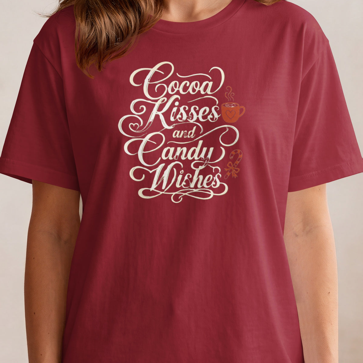Red t-shirt with "Cocoa Kisses and Candy Wishes" text, hot cocoa, and candy cane graphic.
