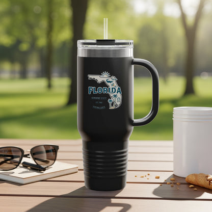 Black tumbler with Florida map graphic and "Sunshine State" text, outdoors.