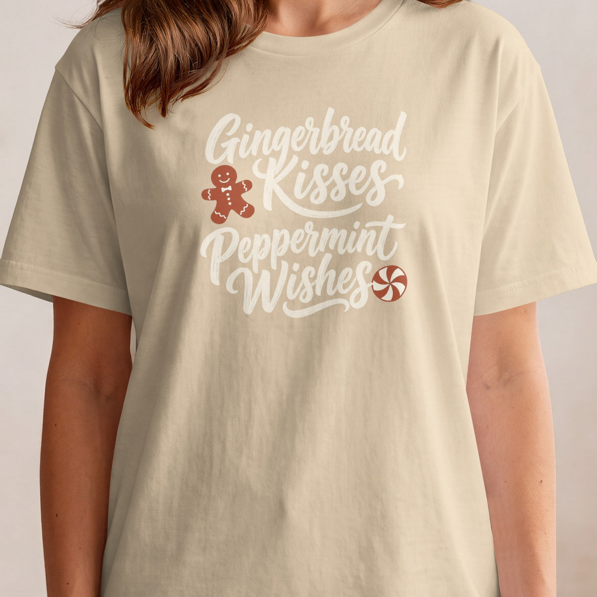 Light tan t-shirt with "Gingerbread Kisses Peppermint Wishes" and graphics.