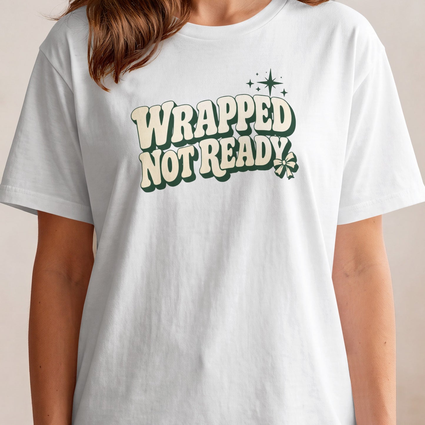 White t-shirt with text "WRAPPED NOT READY" and a shamrock graphic.