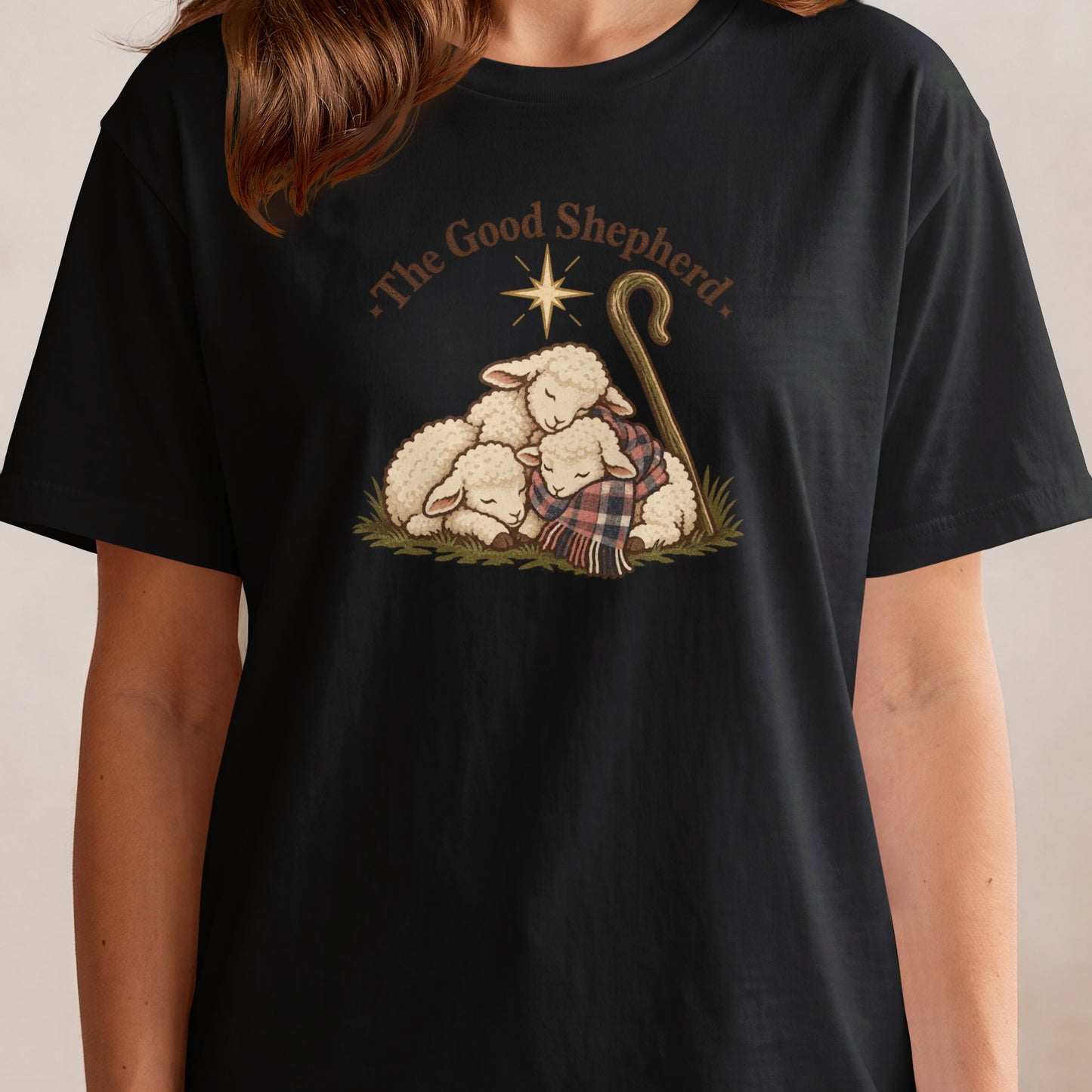 Three sheep huddle together with a shepherd's crook and star above them.