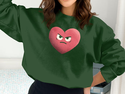 Green Sweatshirt with Grumpy Red Heart Graphic Design