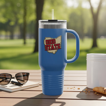 Blue travel mug with "Ohio State" logo and handle, on a table.
