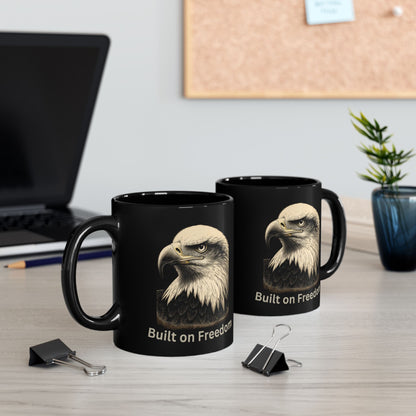 Two black mugs with eagle graphic and "Built on Freedom" text.
